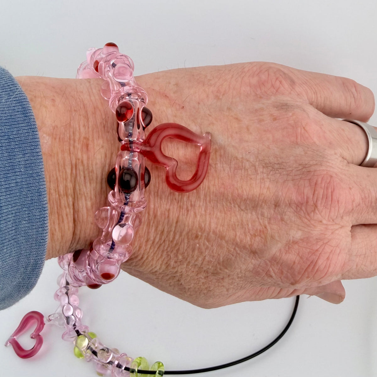Pink Glass Stretchy Bead Bracelet with Heart Pendant 7 Inch Diameter and comes with A floating frame casefor Night Out Fashion - JeffBeckerGlass.com