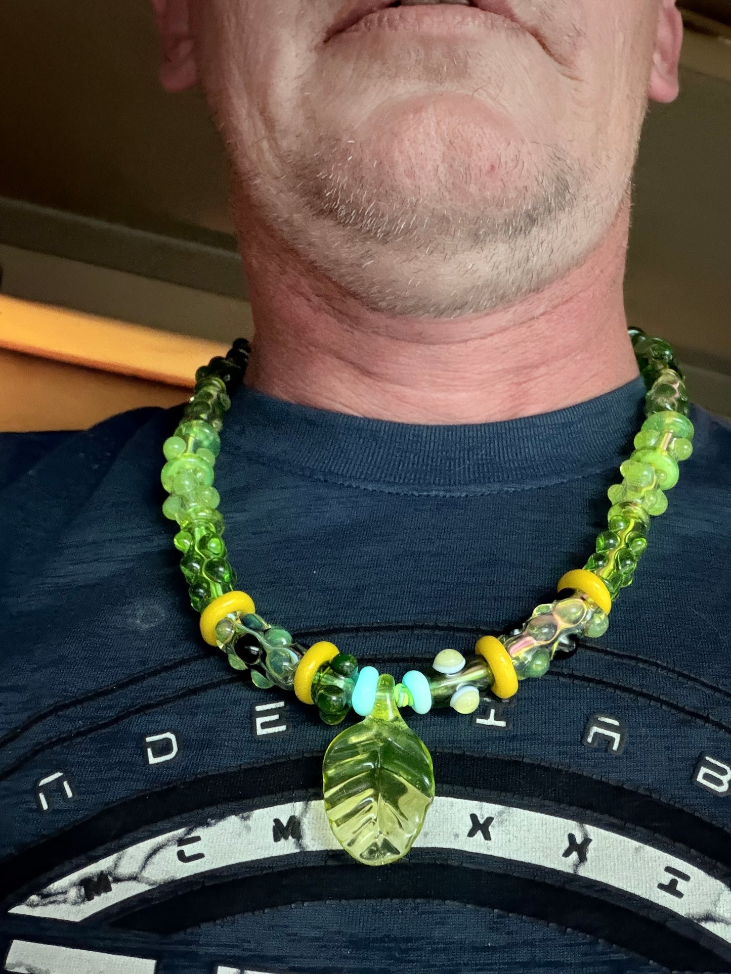 Stretchy Jade Green Glass Necklace with Turtle and dots that Glow Bright Green Under Black Light