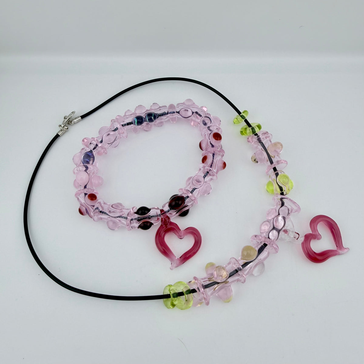 Pink Glass Stretchy Bead Bracelet with Heart Pendant 7 Inch Diameter and comes with A floating frame casefor Night Out Fashion - JeffBeckerGlass.com