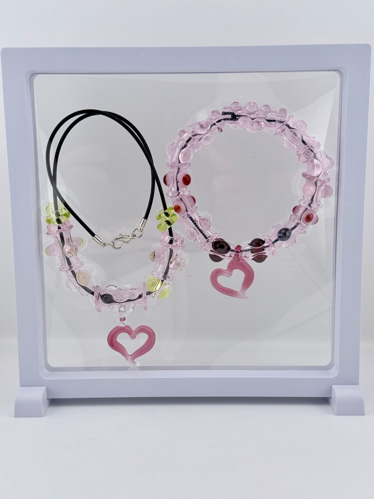 Pink Glass Stretchy Bead Bracelet with Heart Pendant 7 Inch Diameter and comes with A floating frame casefor Night Out Fashion - JeffBeckerGlass.com