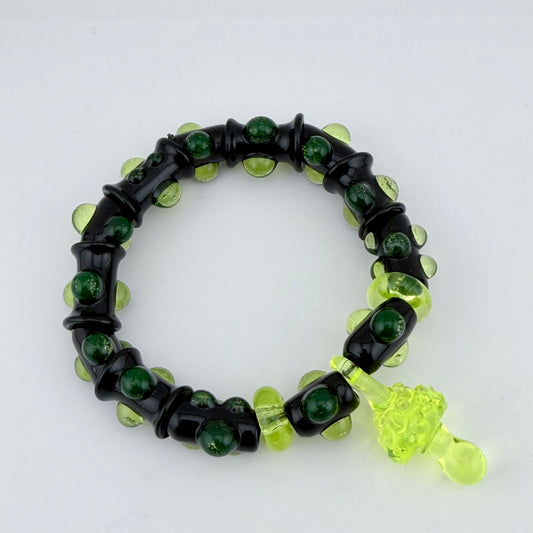 Stretchy Black Glass Bracelet with Green dots that Glow Bright Under Black Light