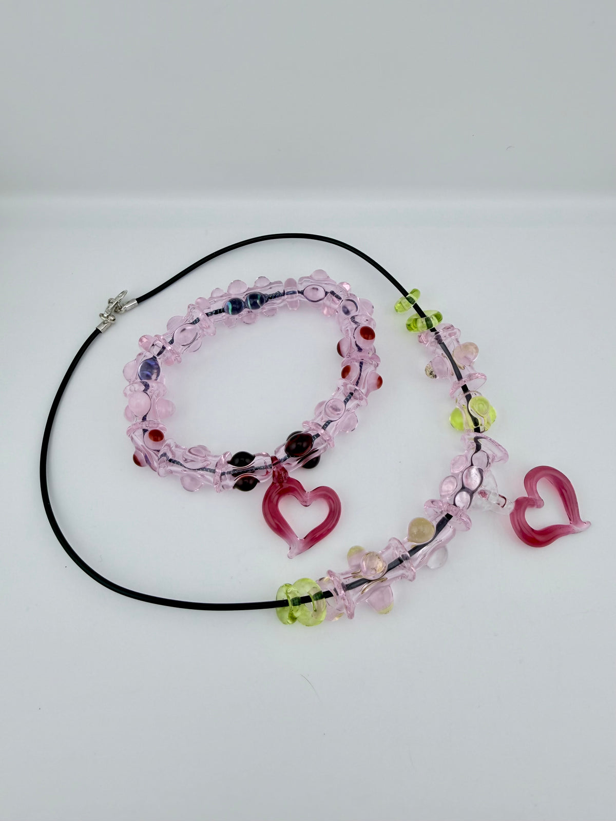 Pink Glass Stretchy Bead Bracelet with Heart Pendant 7 Inch Diameter and comes with A floating frame casefor Night Out Fashion - JeffBeckerGlass.com