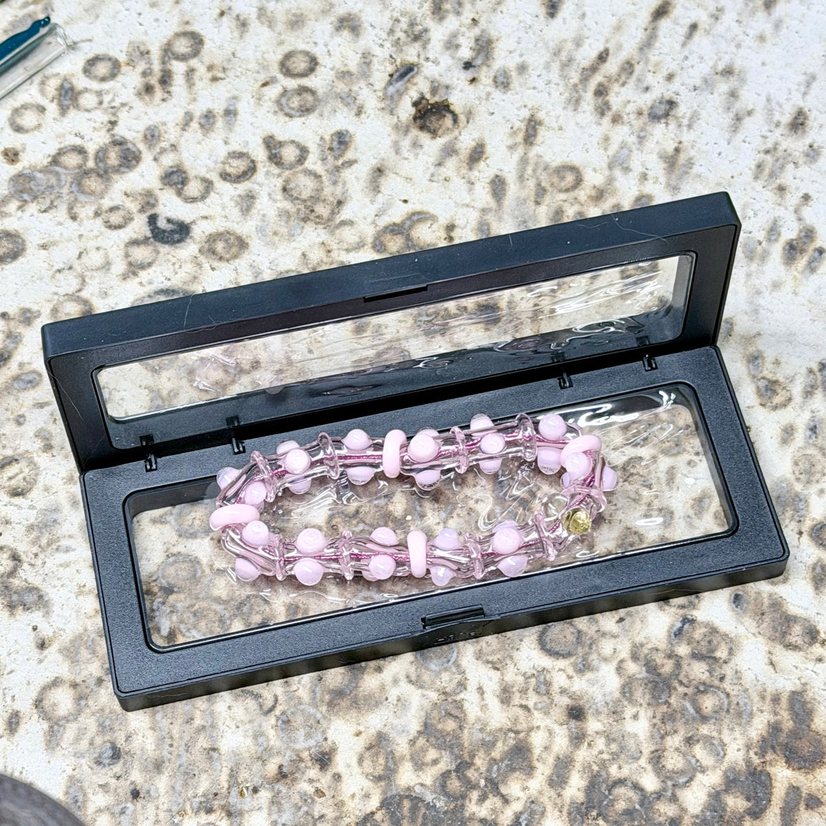 Stretchy Pink Glass Bracelet that Glow Bright Pink Under BlackLight - JeffBeckerGlass.com