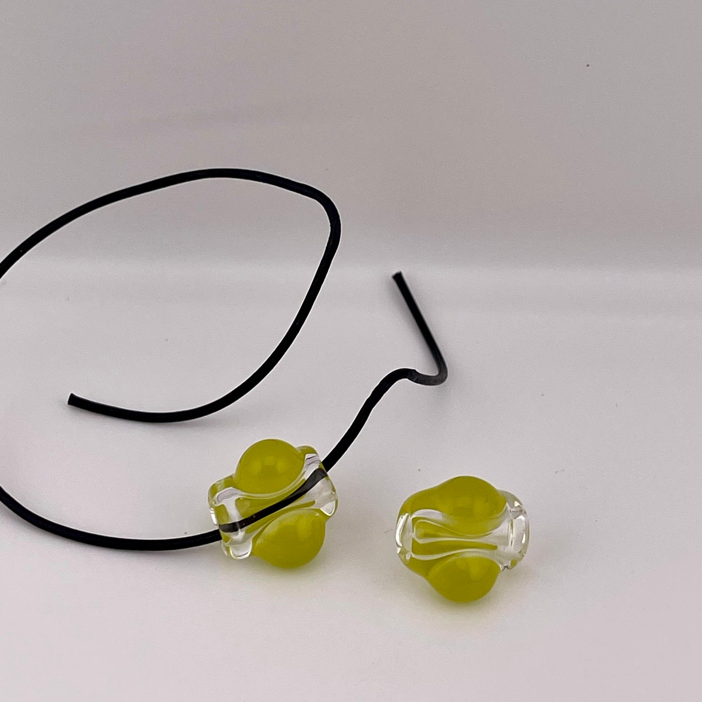 2 Clear beads with Yellow Green marbles