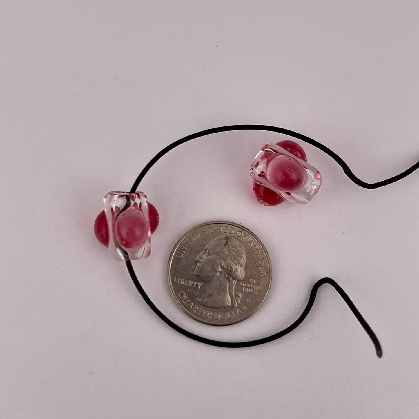 2 Clear beads with Gold Ruby marbles