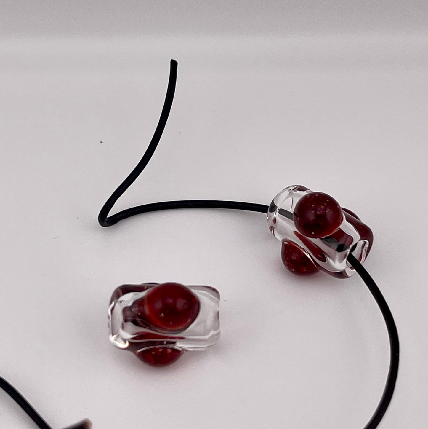 2 Clear beads with Blizzard Red marbles