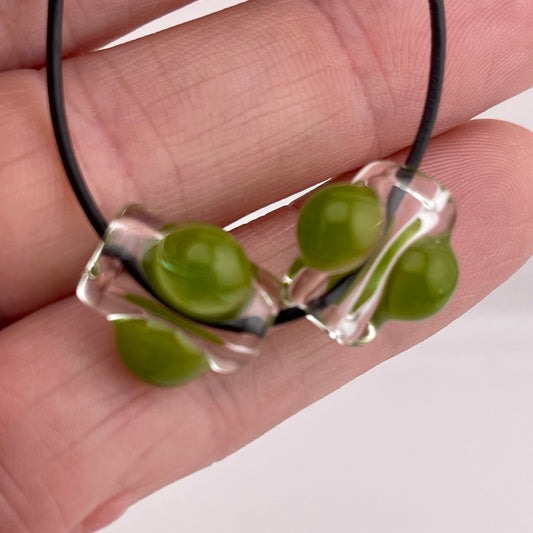 2 Clear beads with Timber Green marbles - JeffBeckerGlass.com