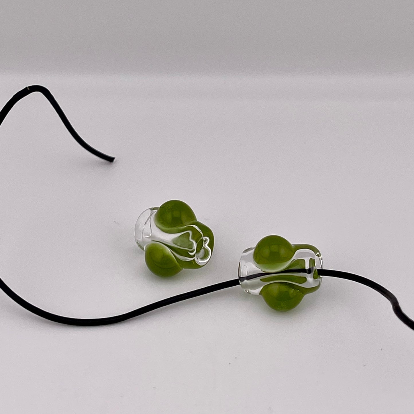 2 Clear beads with Timber Green marbles