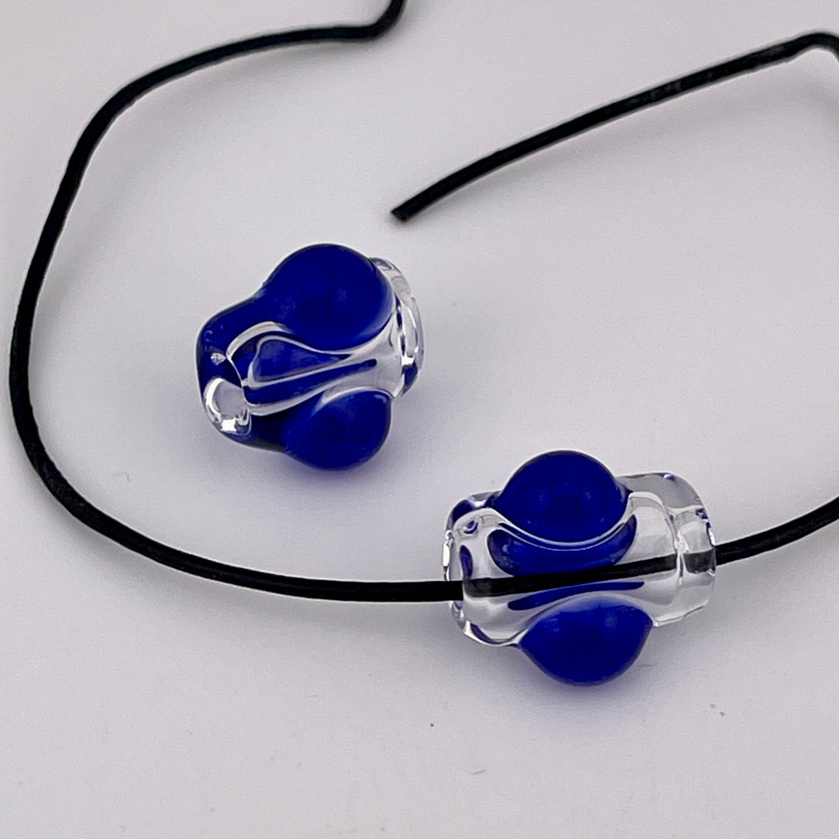 2 Clear beads with Blue marbles - JeffBeckerGlass.com