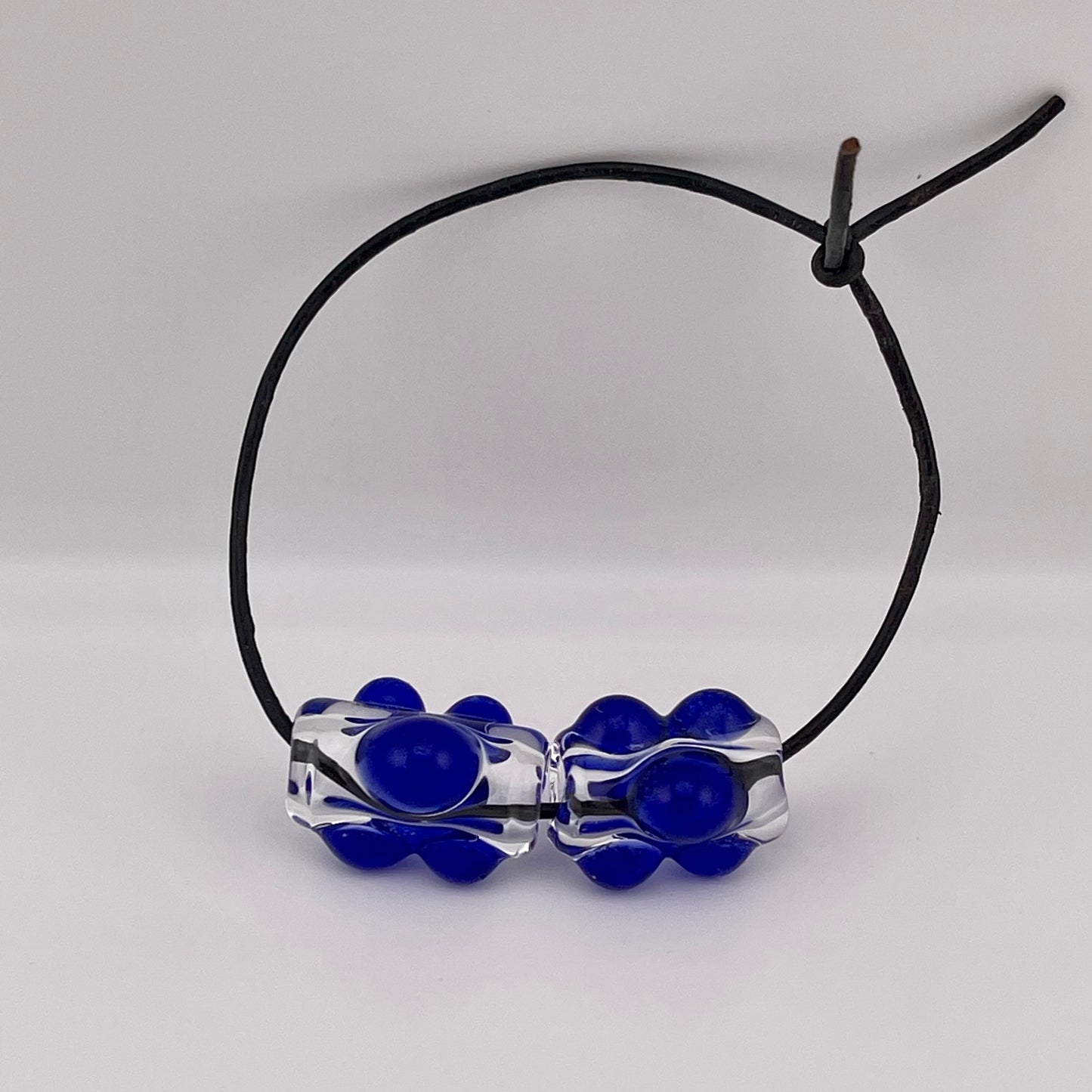 Clear Glass Barrel Bead with Blue Marbles