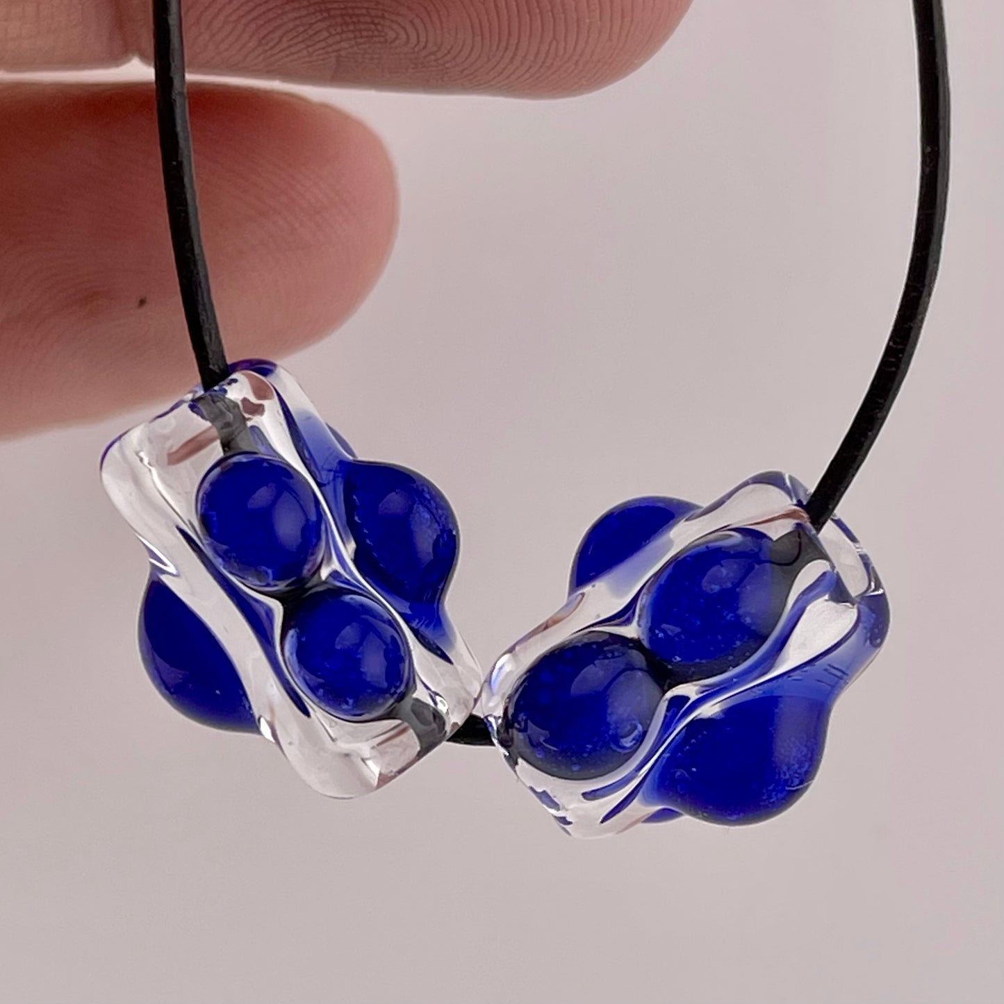 Clear Glass Barrel Bead with Blue Marbles