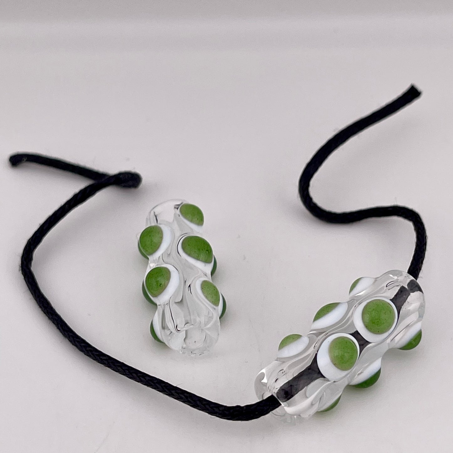 2 Clear Glass Barrel Bead with sparkly Green over White Marbles - JeffBeckerGlass.com