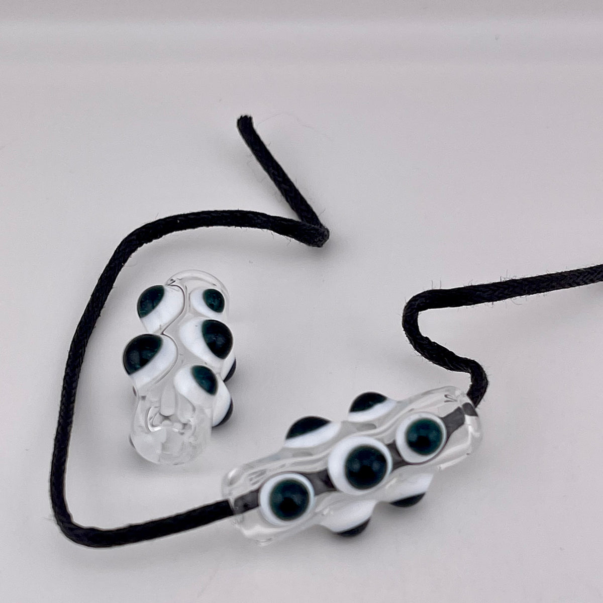 2 Clear Barrel Bead with Sparkly Blue over White accent marbles - JeffBeckerGlass.com