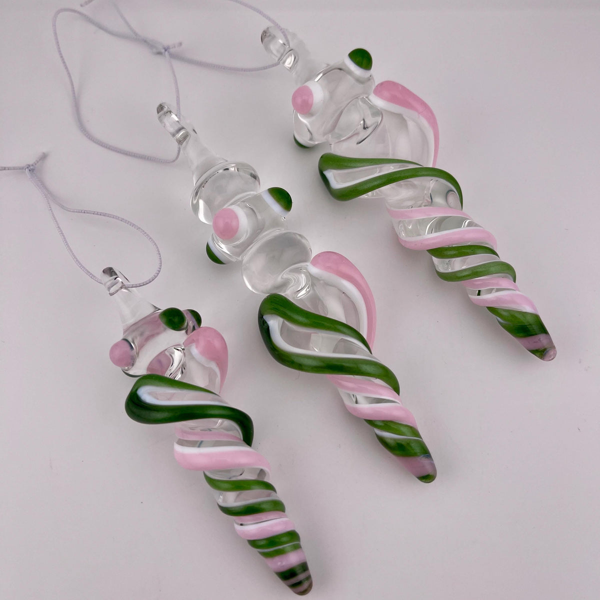3 Pack of Pink and Sparkly Green over Lotus White Glass Icicle Ornament Designs “Holiday Special” - JeffBeckerGlass.com