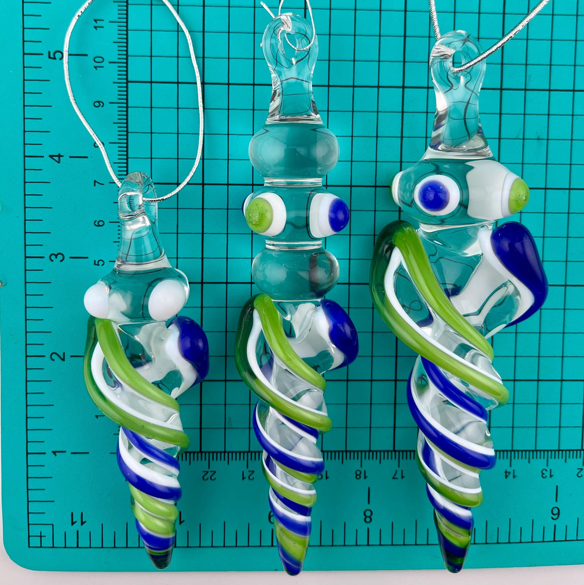 3 Pack of Sparkly Green and Cobalt Blue over Lotus White Glass Icicle Ornament Designs “Holiday Special” - JeffBeckerGlass.com