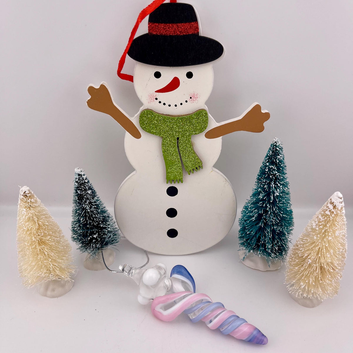 Mini Glass Icicle Ornament with Pink and Light Blue over Lotus White Color Twist - JeffBeckerGlass.com