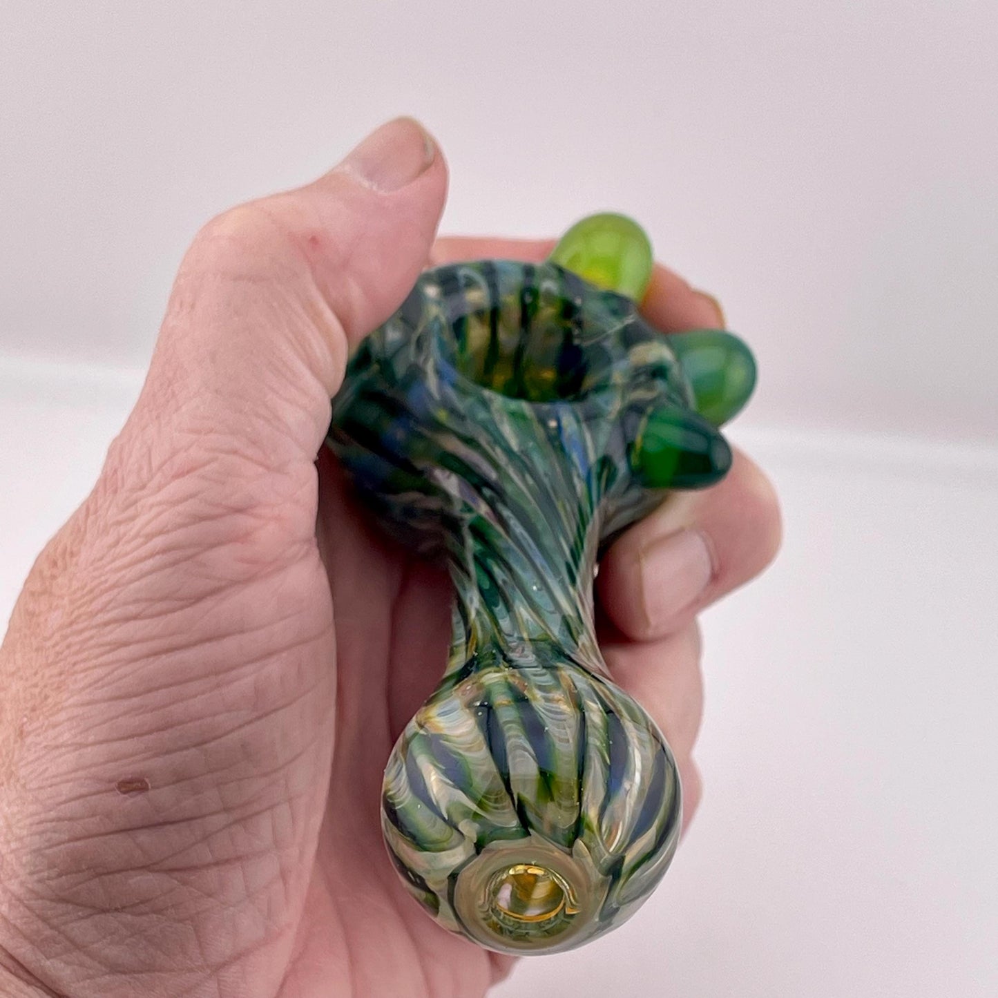 Wrap n Raked Green and Silver Fumed Spoon Pipe with green marbles - JeffBeckerGlass.com