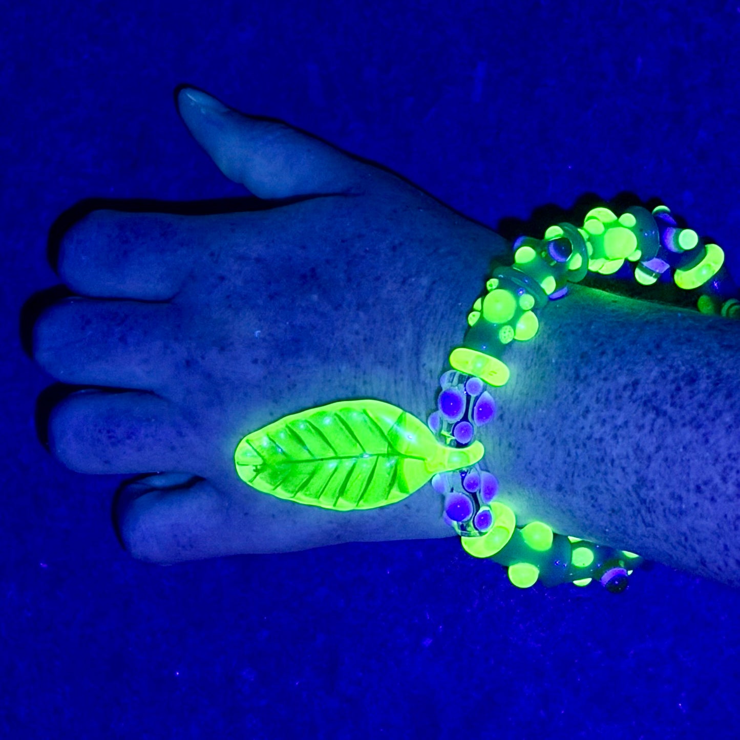Stretchy Jade Green Glass Bracelet with leaf and dots that Glow Bright Green Under Black Light