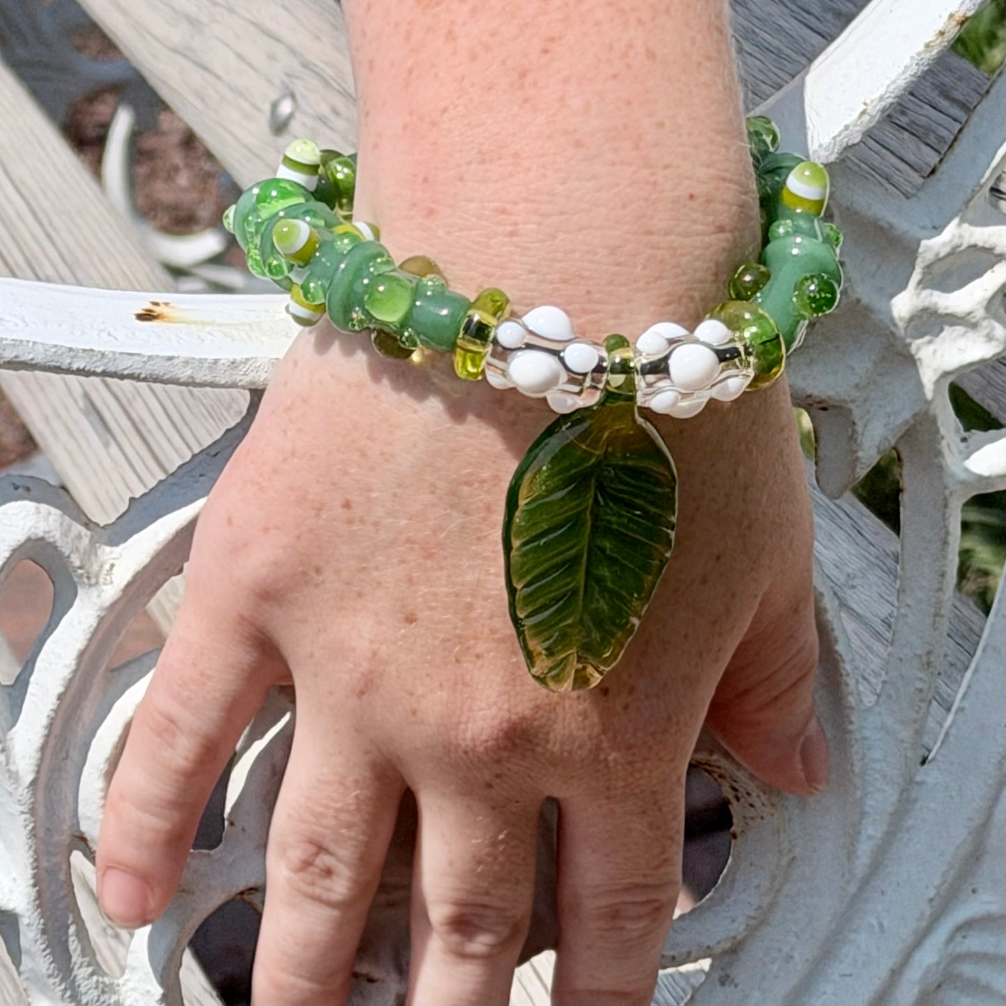 Stretchy Jade Green Glass Bracelet with leaf and dots that Glow Bright Green Under Black Light