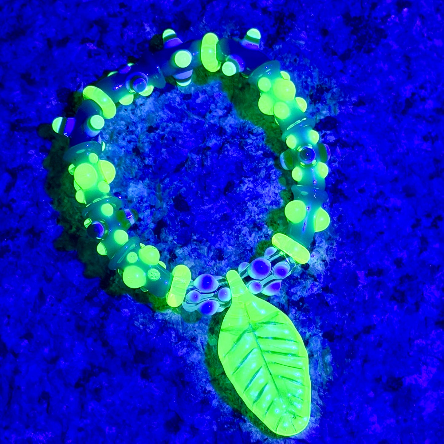 Stretchy Jade Green Glass Bracelet with leaf and dots that Glow Bright Green Under Black Light