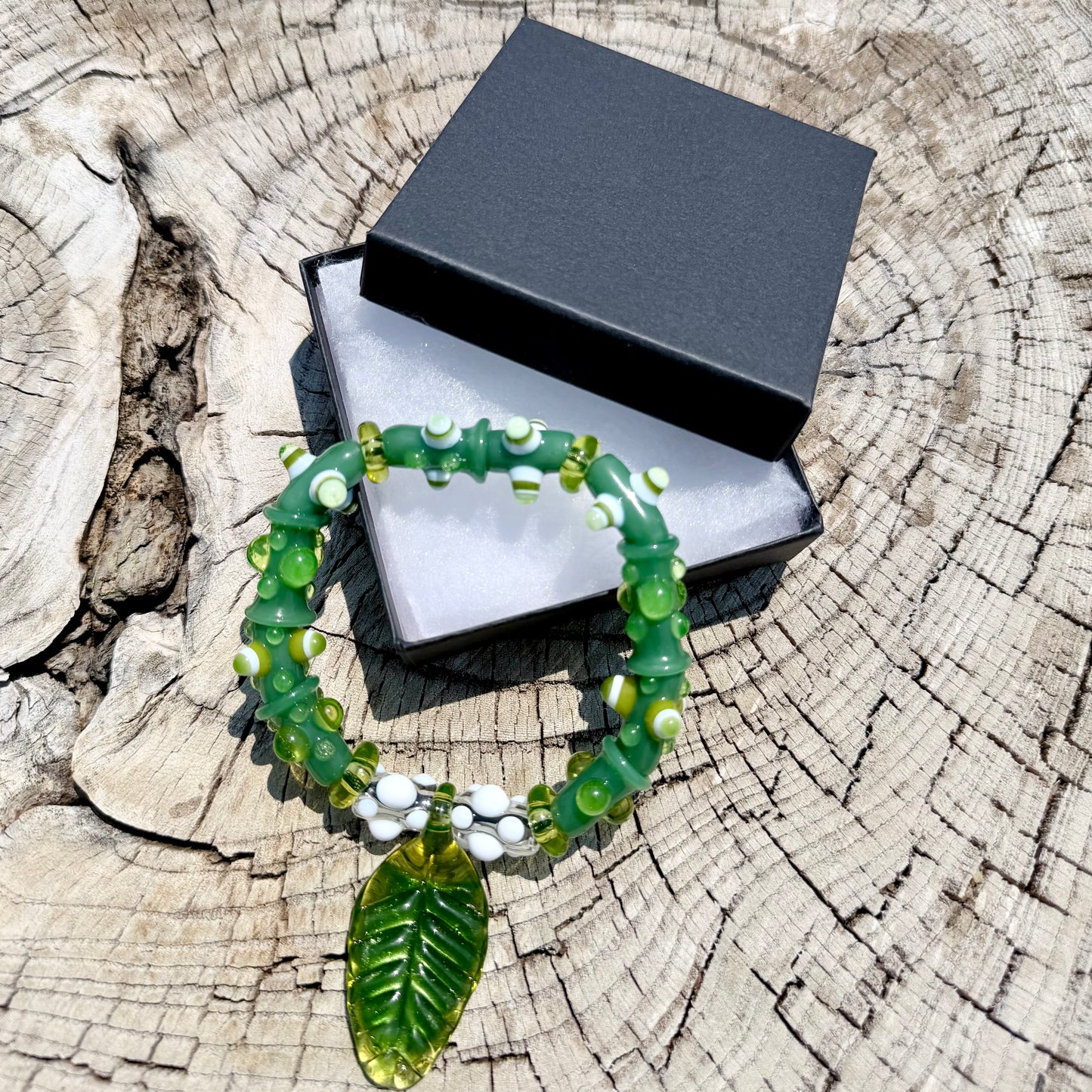 Stretchy Jade Green Glass Bracelet with leaf and dots that Glow Bright Green Under Black Light