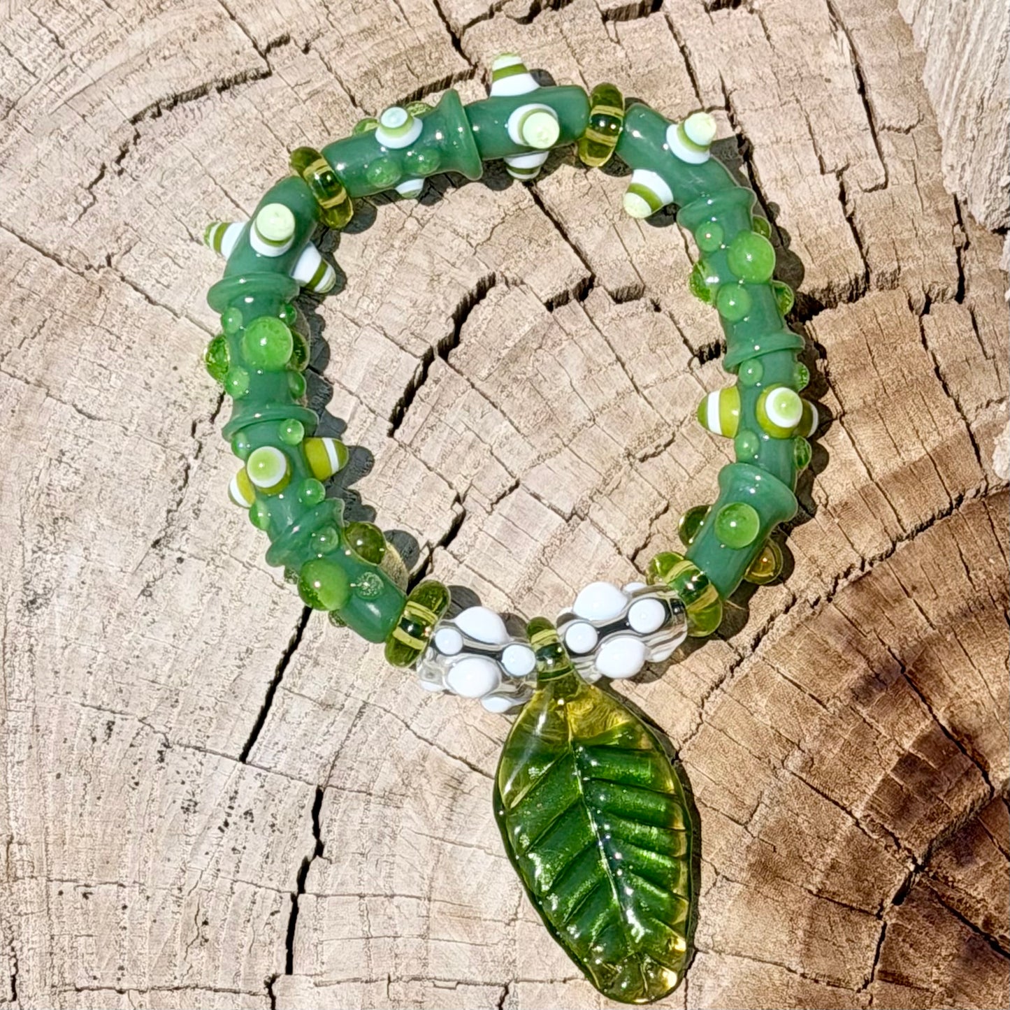 Stretchy Jade Green Glass Bracelet with leaf and dots that Glow Bright Green Under Black Light