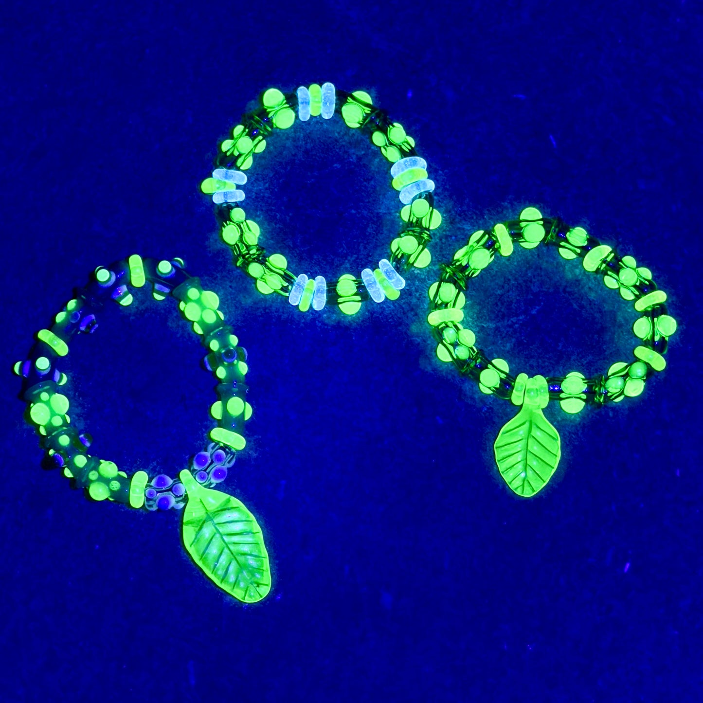 Stretchy Jade Green Glass Bracelet with leaf and dots that Glow Bright Green Under Black Light
