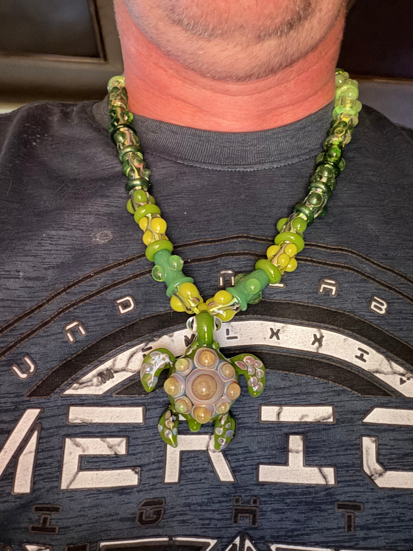 Stretchy Jade Green Glass Necklace with Turtle and dots that Glow Bright Green Under Black Light