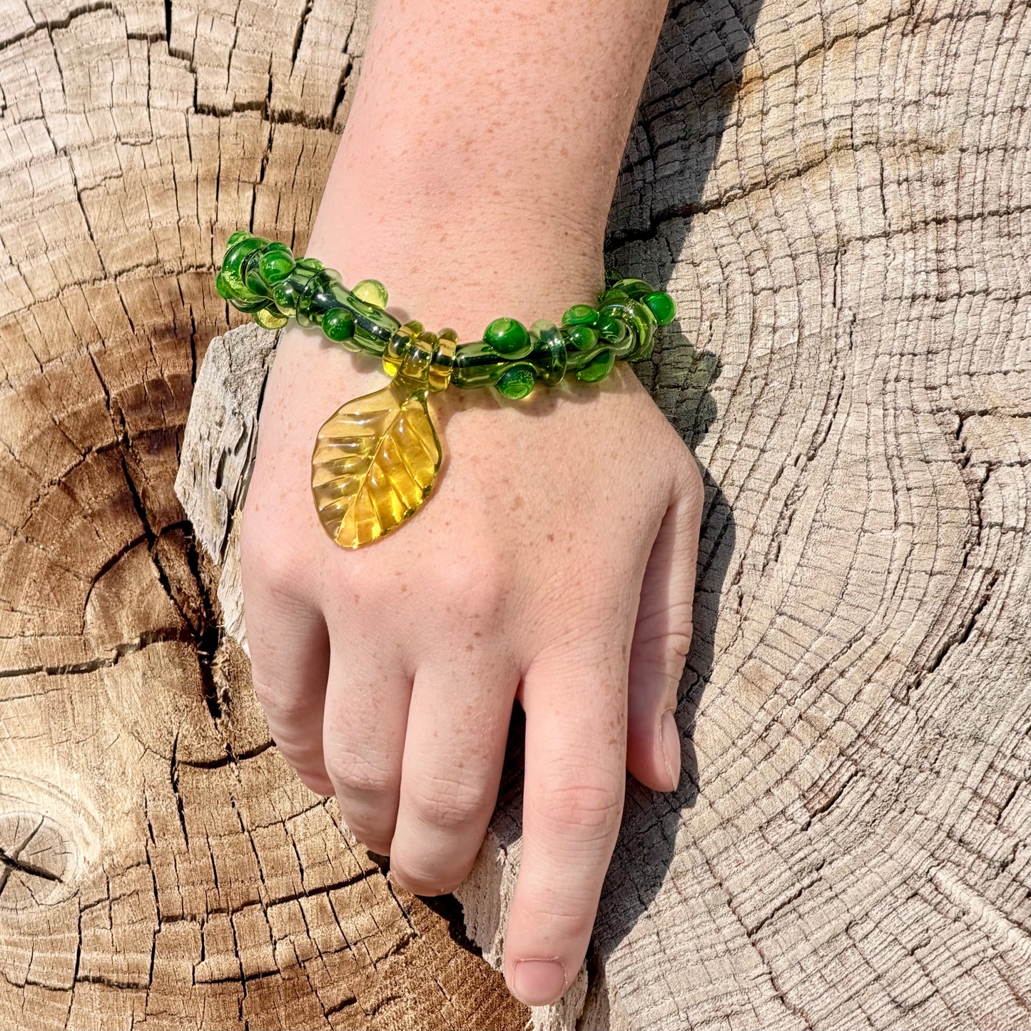 Stretchy  Green Glass Bracelet with leaf and dots that Glow Bright Green Under Black Light