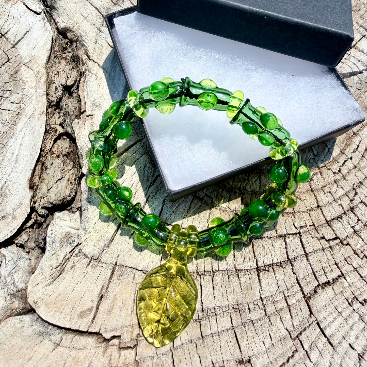 Stretchy  Green Glass Bracelet with leaf and dots that Glow Bright Green Under Black Light