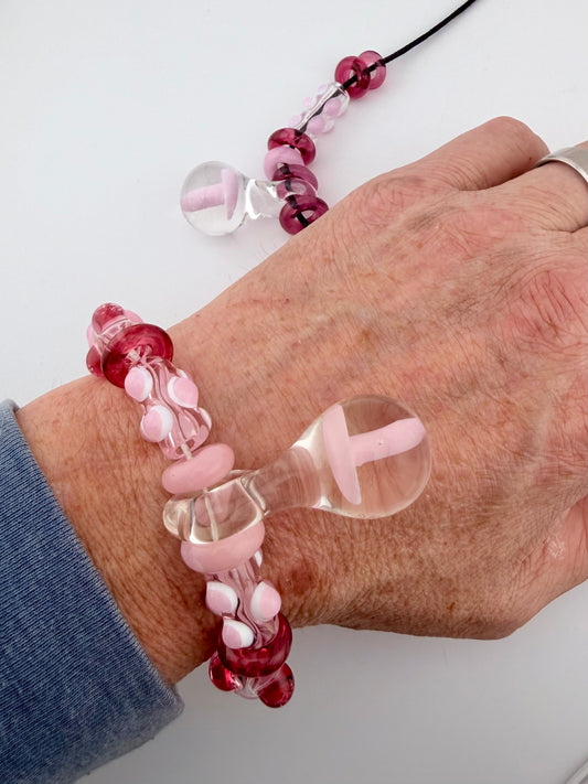 Pink Glass Stretchy Bead Bracelet with Mushroom Pendant 7 Inch Diameter and comes with A floating frame case - JeffBeckerGlass.com