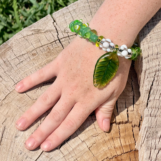 Stretchy Jade Green Glass Bracelet with leaf and dots that Glow Bright Green Under Black Light