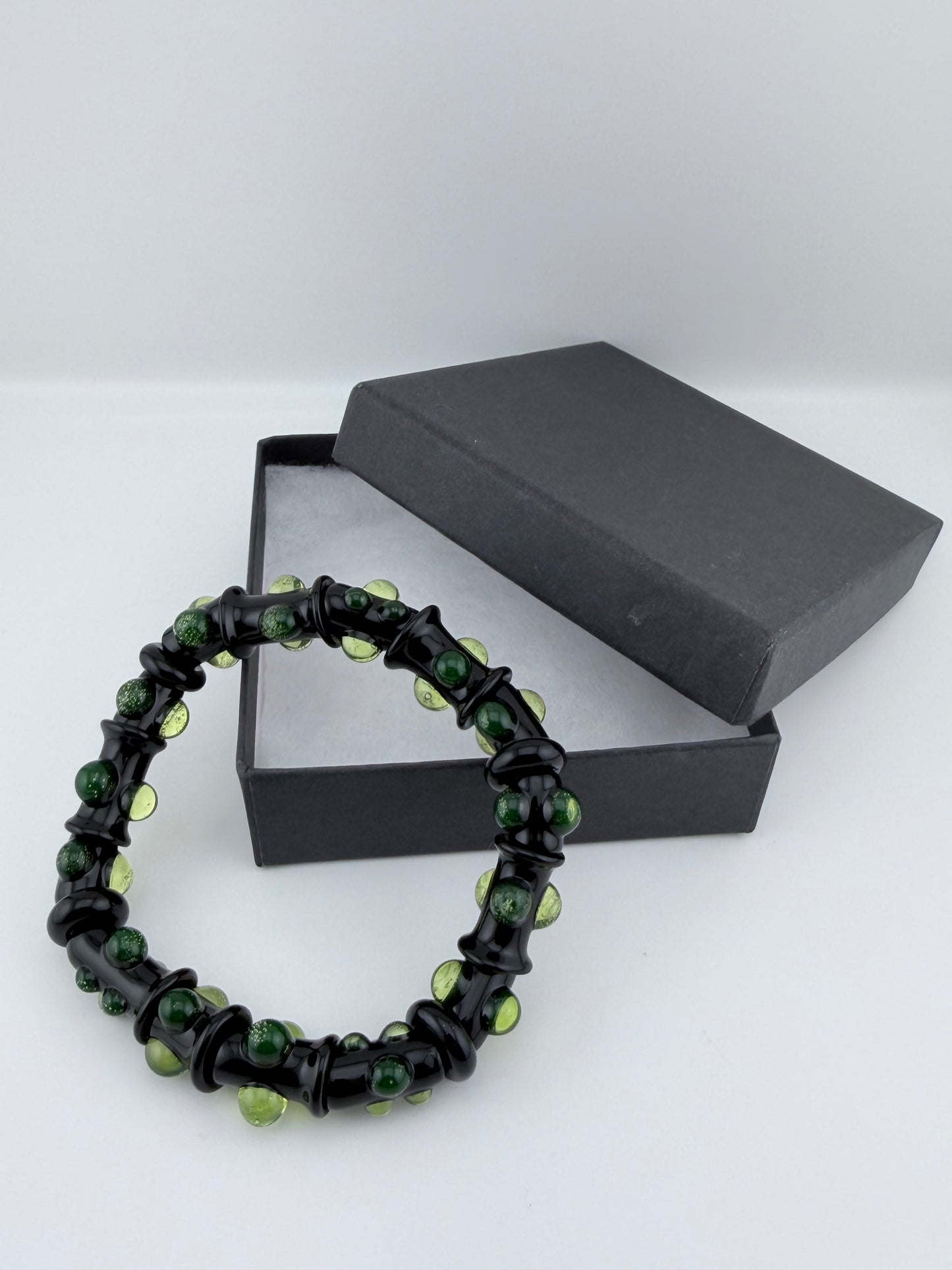 Black UV Reactive Green Dot Glass Bracelet – Glows Green Under Black Light - JeffBeckerGlass.com