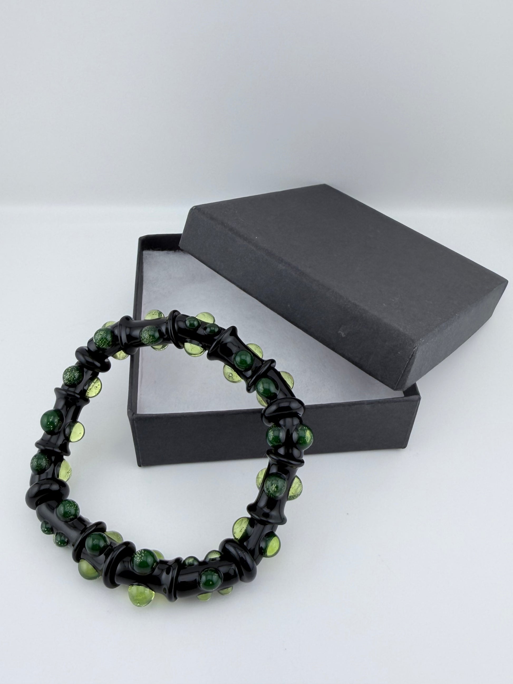 Black UV Reactive Green Dot Glass Bracelet – Glows Green Under Black Light - JeffBeckerGlass.com