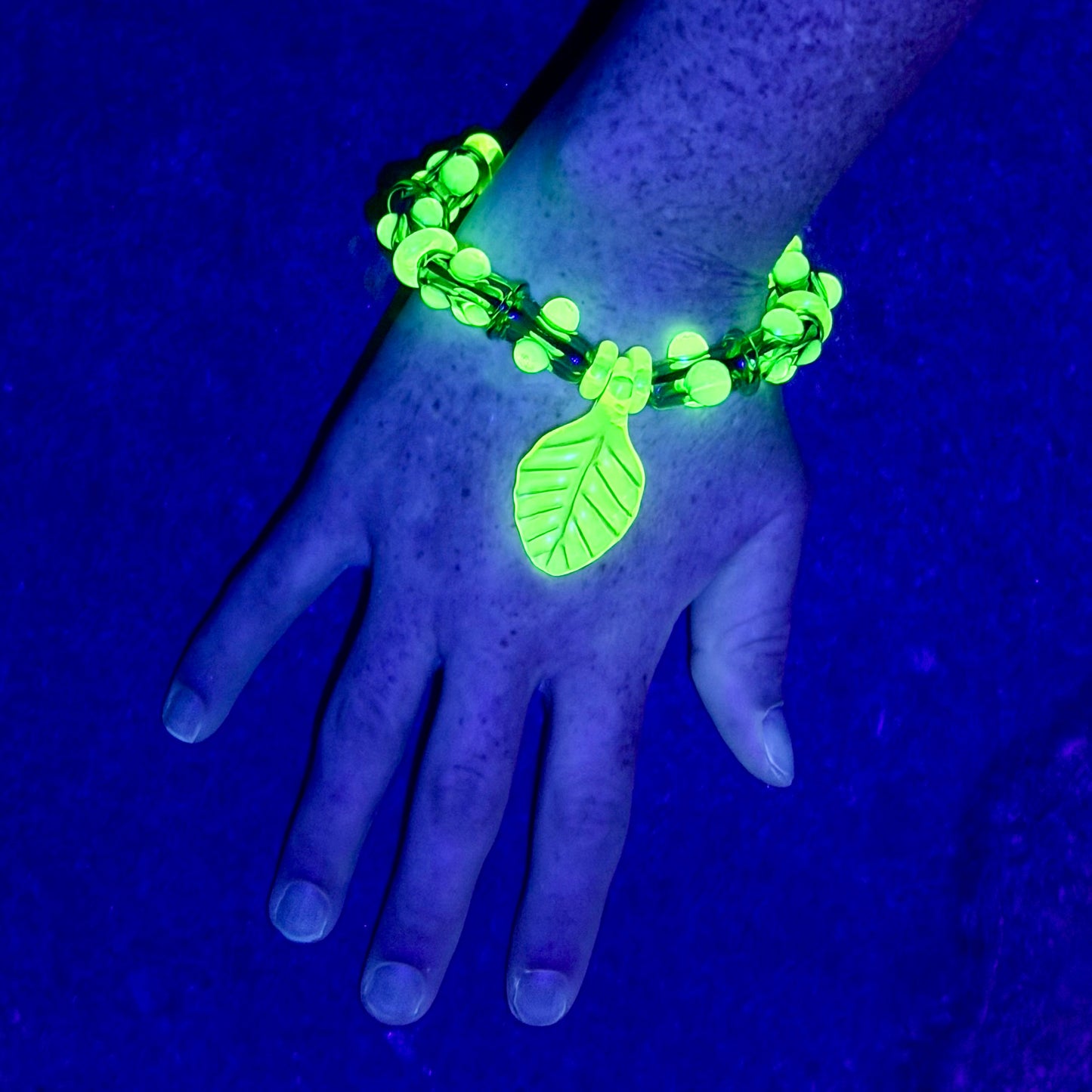 Stretchy  Green Glass Bracelet with leaf and dots that Glow Bright Green Under Black Light
