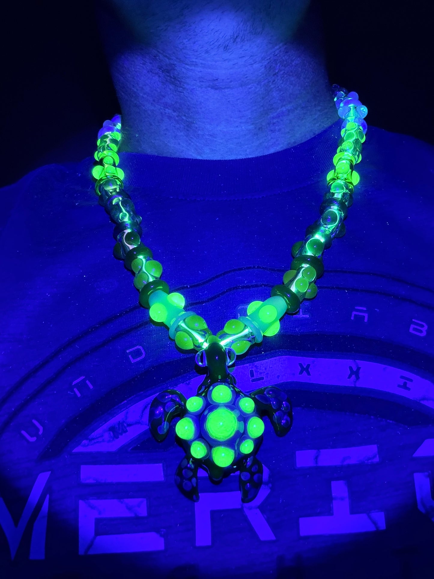 Stretchy Jade Green Glass Necklace with Turtle and dots that Glow Bright Green Under Black Light