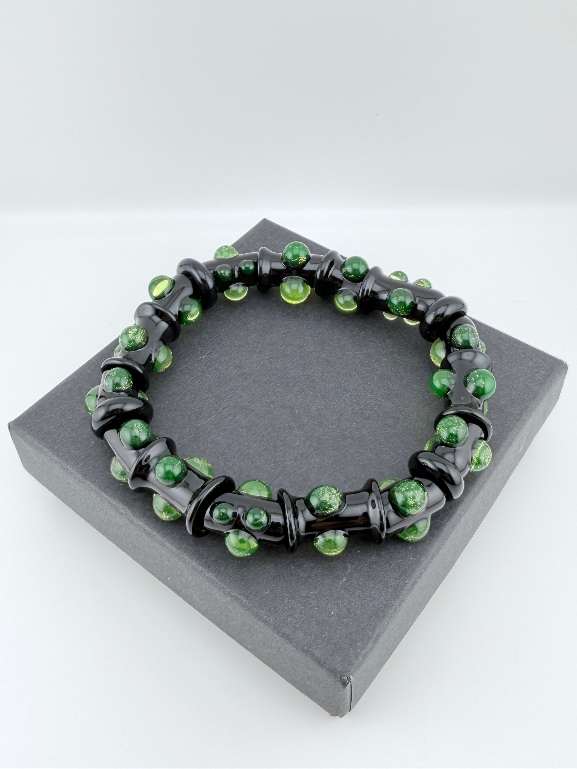 Black UV Reactive Green Dot Glass Bracelet – Glows Green Under Black Light - JeffBeckerGlass.com