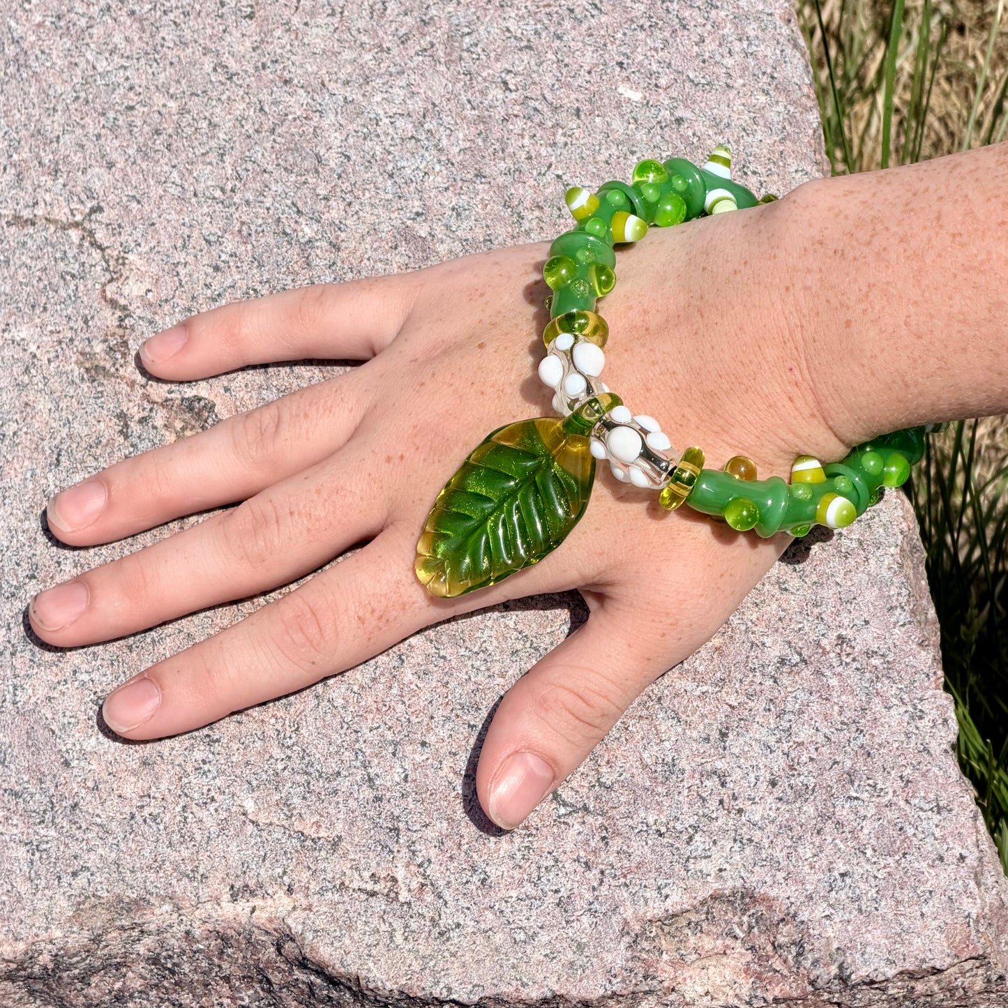 Stretchy Jade Green Glass Bracelet with leaf and dots that Glow Bright Green Under Black Light