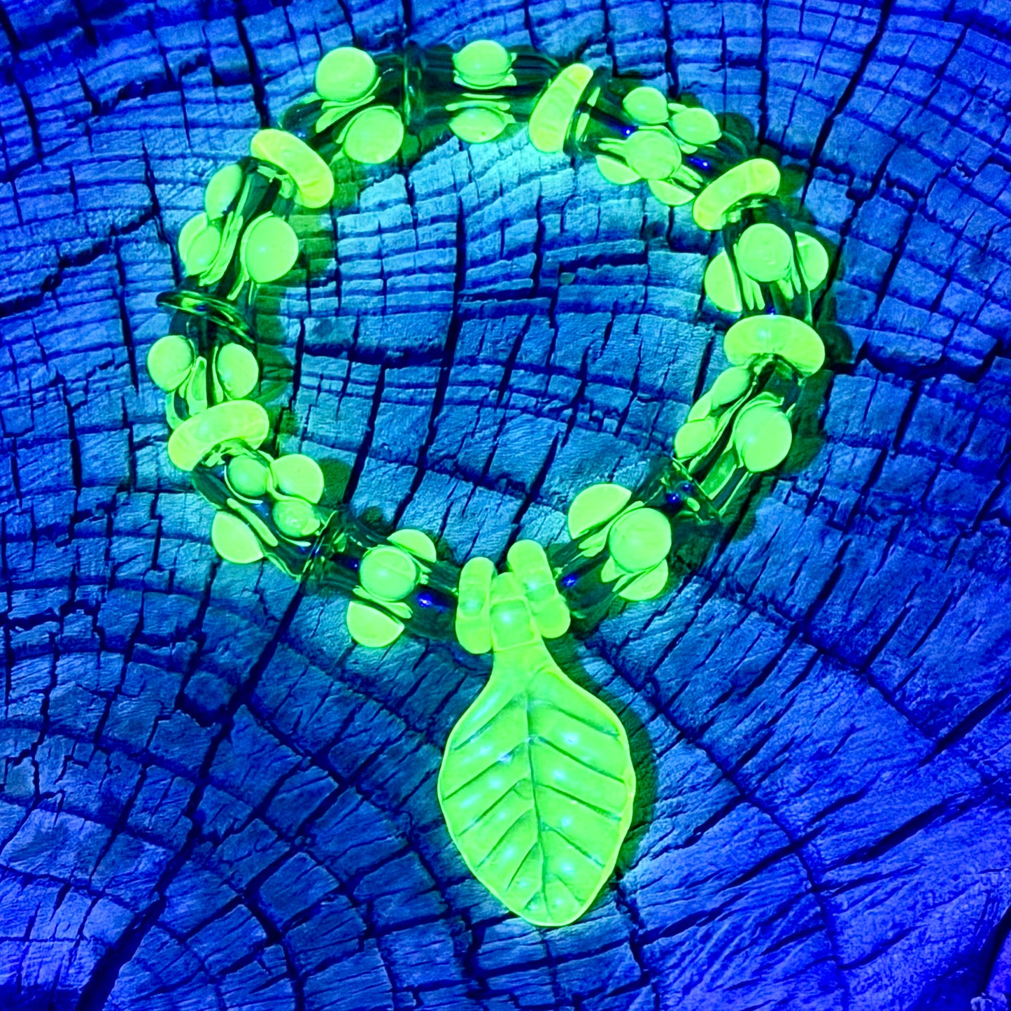 Stretchy  Green Glass Bracelet with leaf and dots that Glow Bright Green Under Black Light