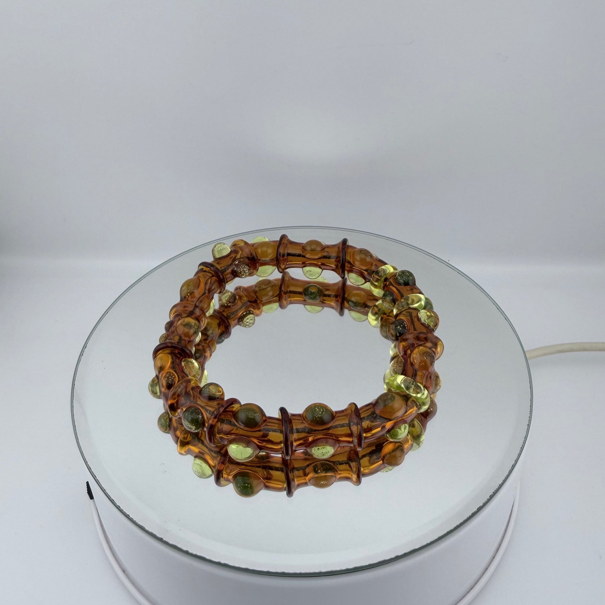 Stretchy Amber Glass Bracelet with dots that Glow Bright Green Under Black Light - JeffBeckerGlass.com