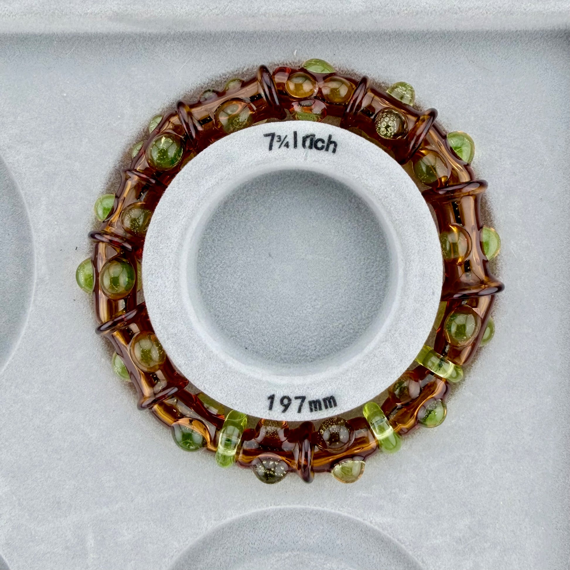 Stretchy Amber Glass Bracelet with dots that Glow Bright Green Under Black Light - JeffBeckerGlass.com