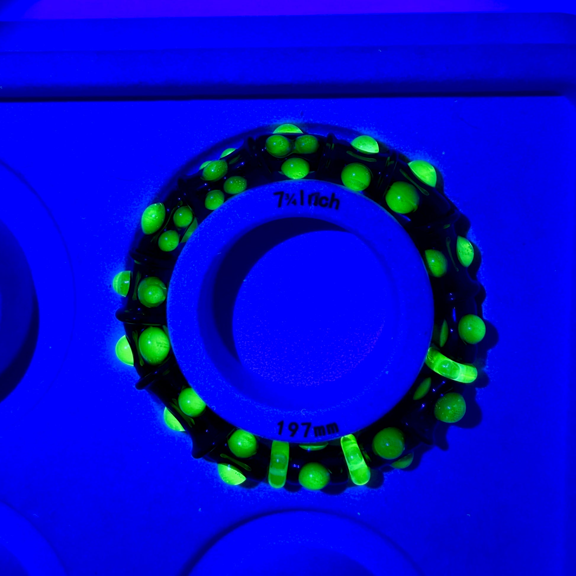 Stretchy Amber Glass Bracelet with dots that Glow Bright Green Under Black Light - JeffBeckerGlass.com