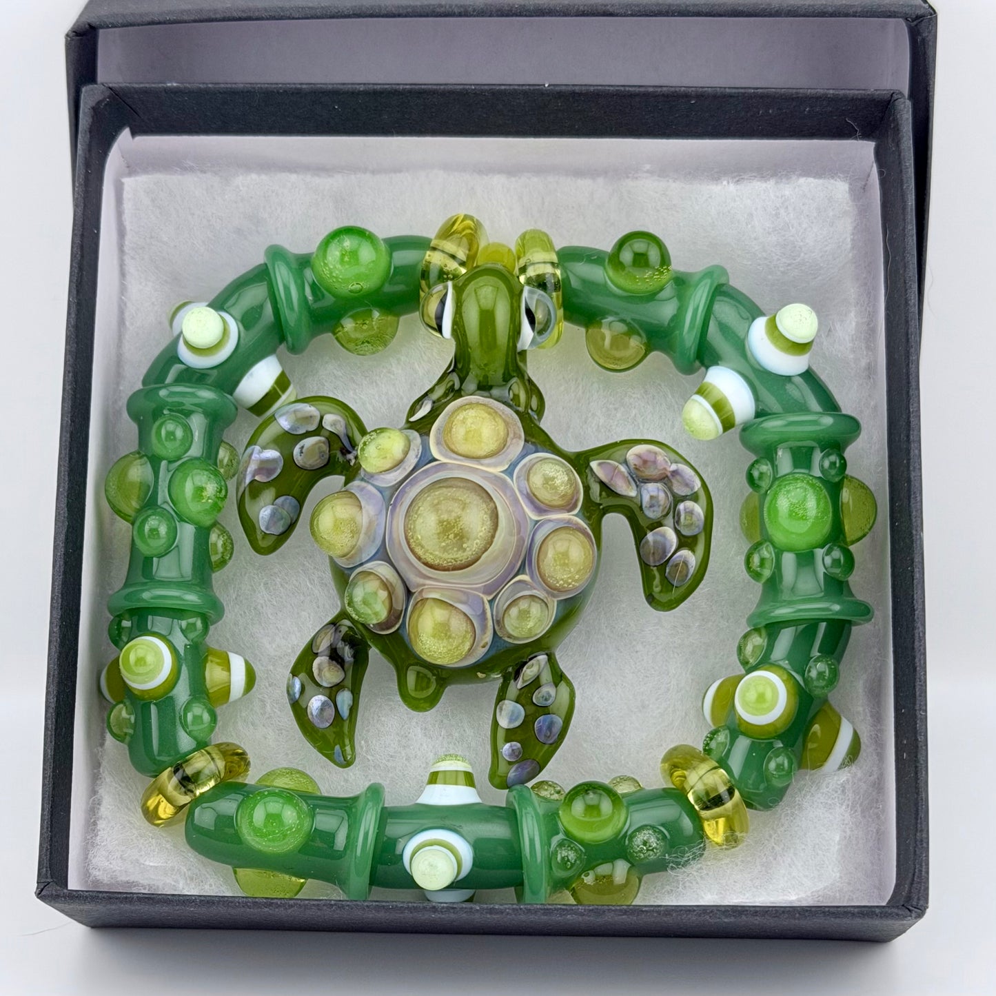 Stretchy Jade Green Glass Bracelet with Turtle and dots that Glow Bright Green Under Black Light