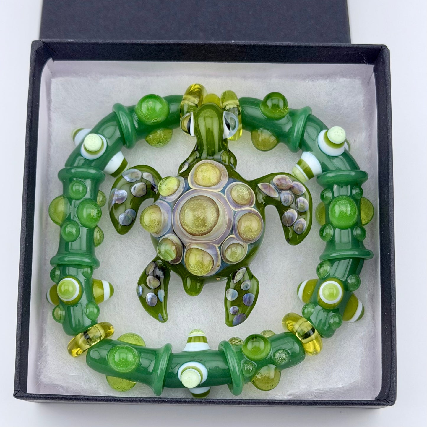 Stretchy Jade Green Glass Bracelet with Turtle and dots that Glow Bright Green Under Black Light
