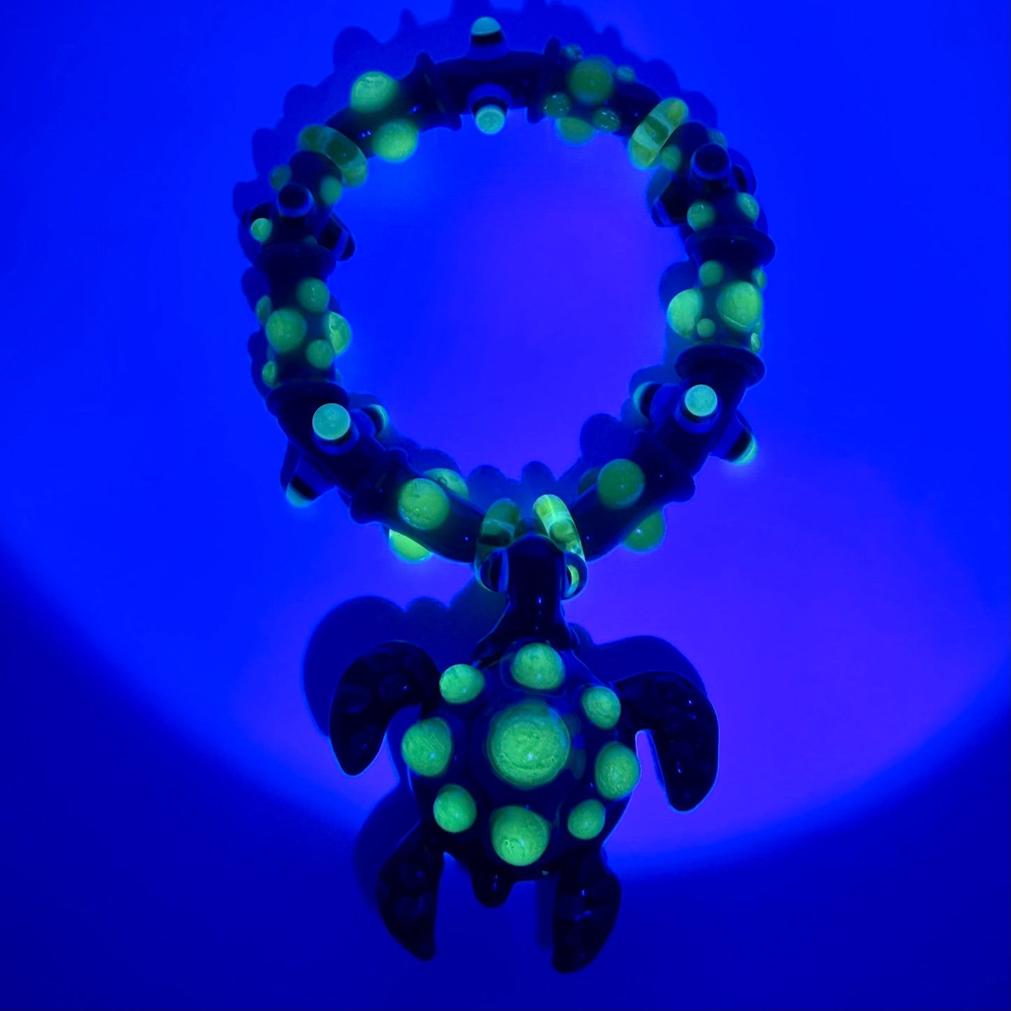 Stretchy Jade Green Glass Bracelet with Turtle and dots that Glow Bright Green Under Black Light