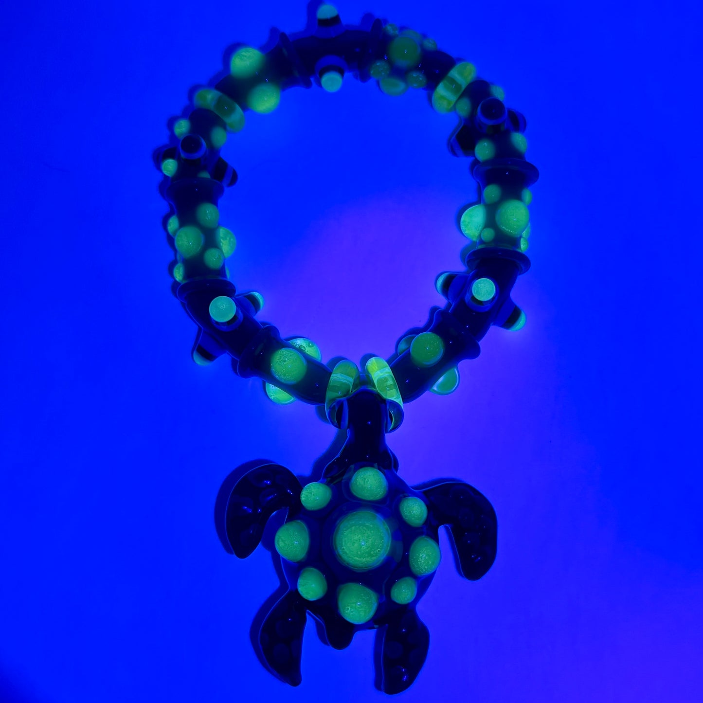 Stretchy Jade Green Glass Bracelet with Turtle and dots that Glow Bright Green Under Black Light