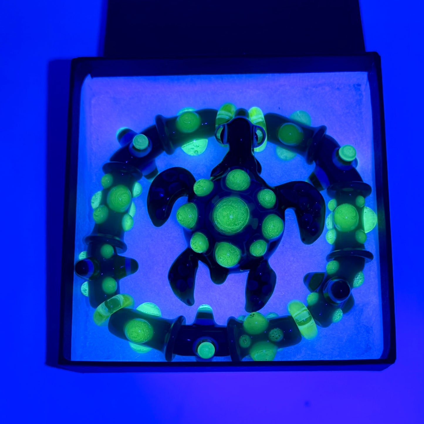 Stretchy Jade Green Glass Bracelet with Turtle and dots that Glow Bright Green Under Black Light