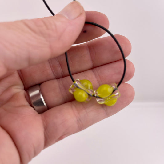 2 Clear beads with Yellow Green marbles