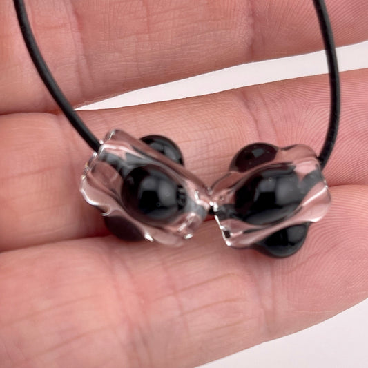 2 Clear beads with Black marbles