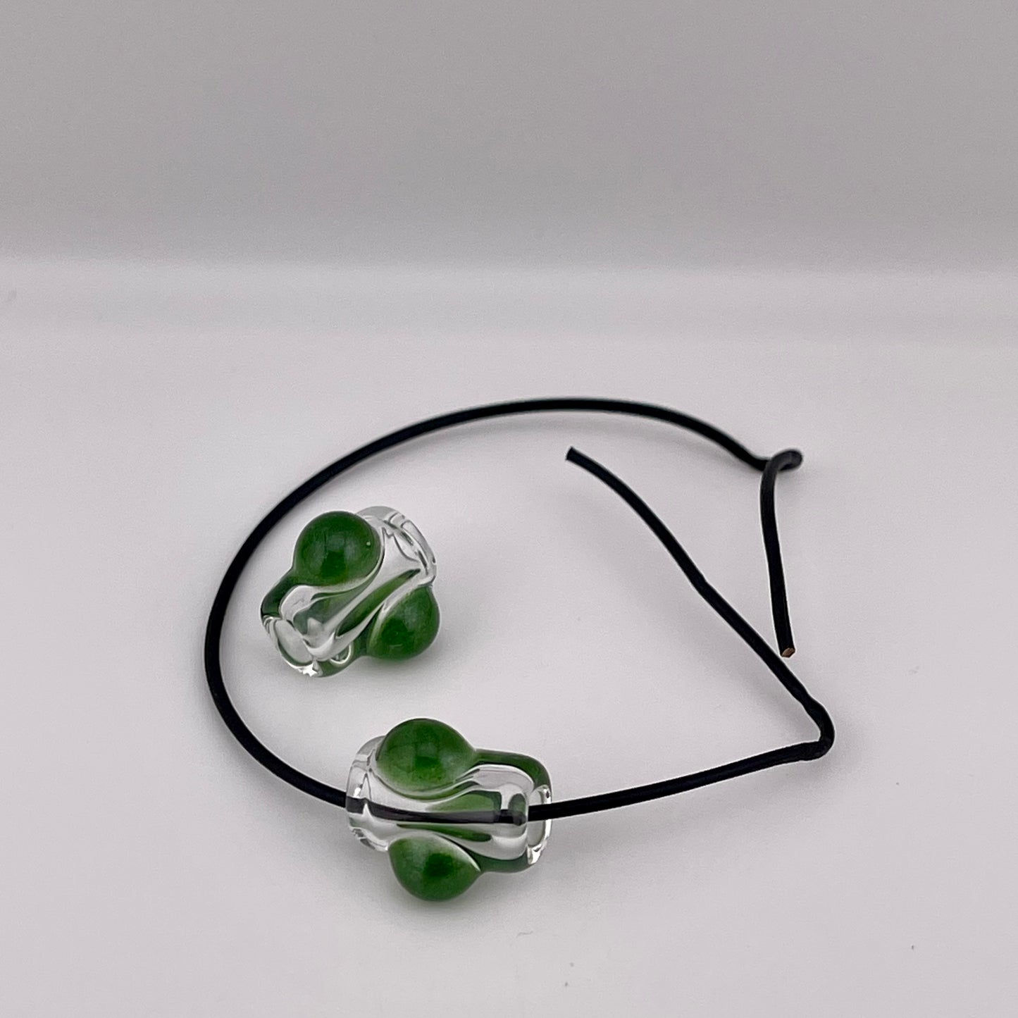 2 Clear beads with Sparkly Green marbles